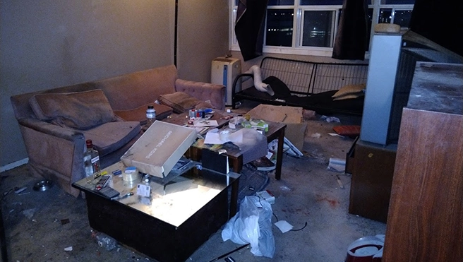 An apartment living room in need of cleaning.