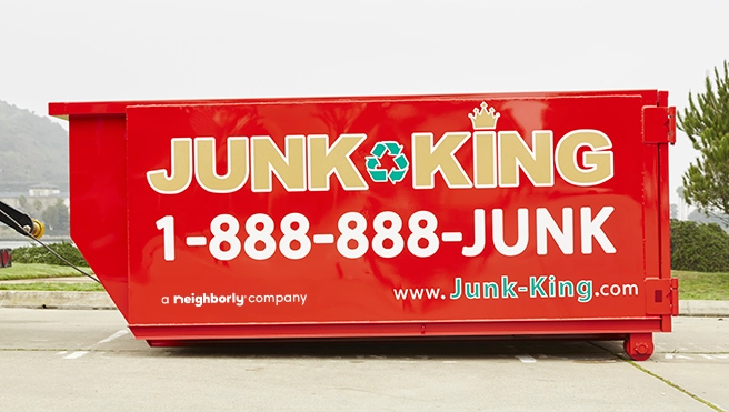 Red Junk King dumpster.