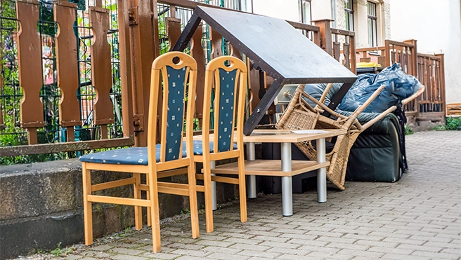 Furniture sitting outside of a home.