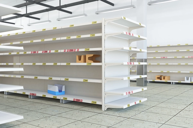 Commercial space with empty retail shelves.