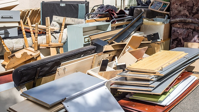 A large pile of wood and furniture.