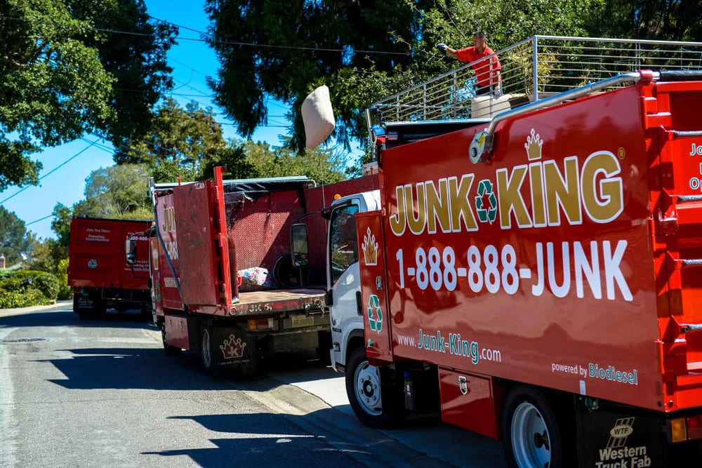 3 junk king truck travelling on Boston Road