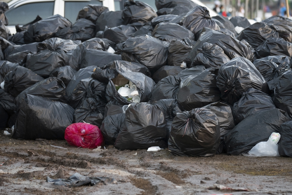 pile of black garbage bags