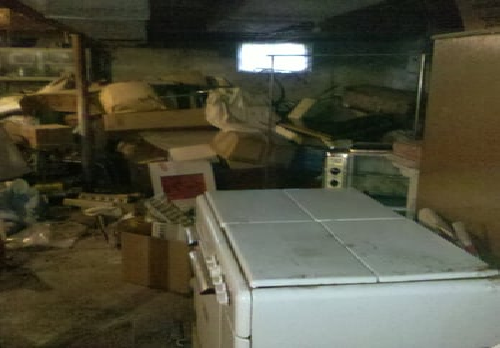 old fridge, boxes and debris