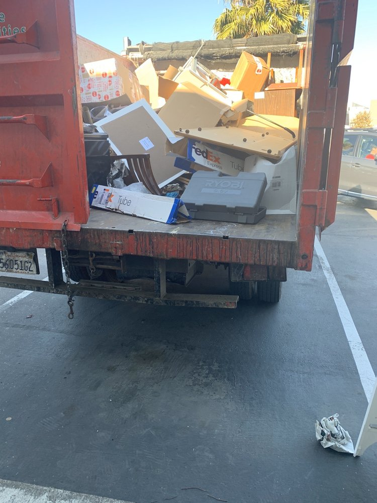 Junk King Dumpster filled with Debris