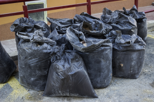 pile of filled black garbage bags