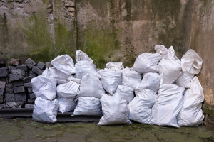 Piles of Garbage in White Bags