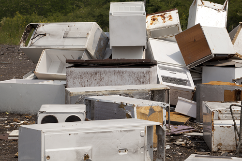 Pile of old white appliances 