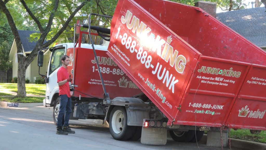 Junk King Dumpster Truck picking up after renovations