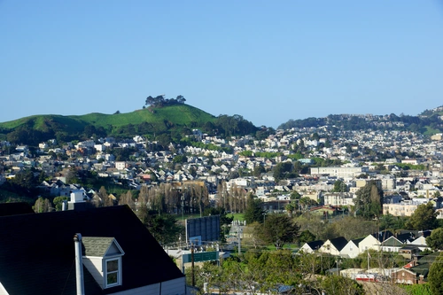 Bayview neighborhood homes on hillside with cityscape view in San Francisco