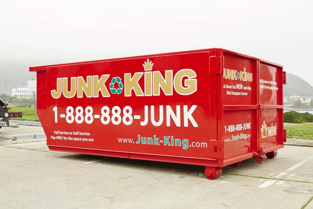 Stacked red bin rentals ready for delivery and use
