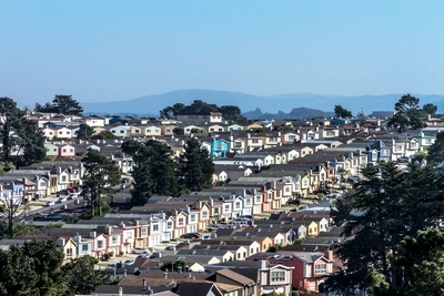 Colorful row houses in Daly City overlooking San Francisco skyline