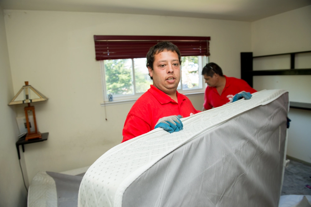 Junk King team removing old furniture in Half Moon Bay