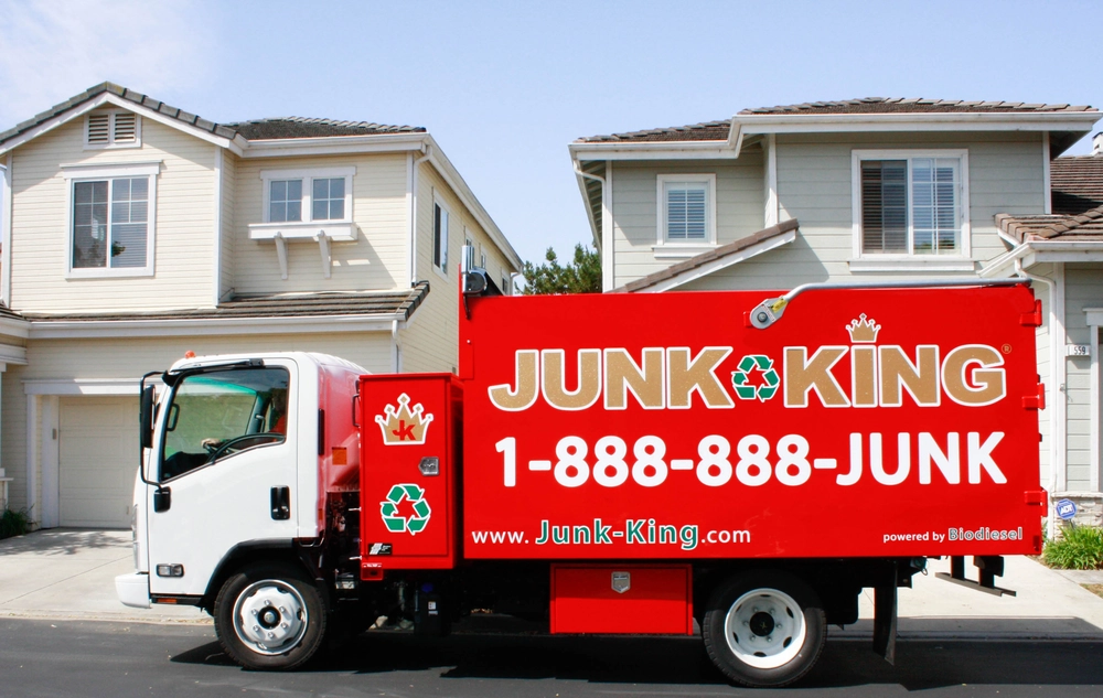 Appliance removal team loading old fridge in Redwood City