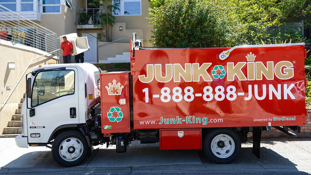 Junk King team removing old furniture from a home in Ashbury Heights