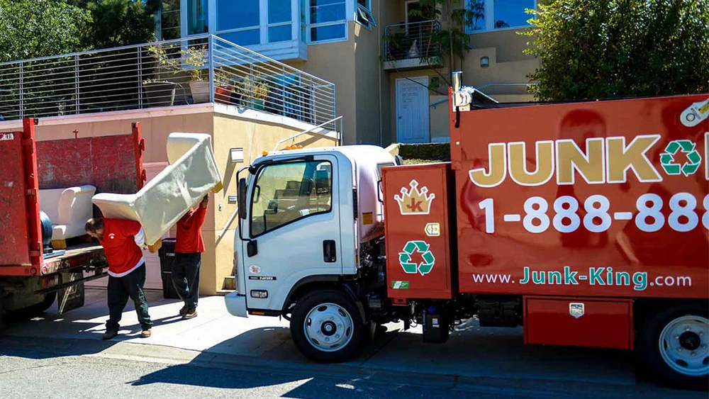 Team lifting old furniture during San Carlos junk removal job
