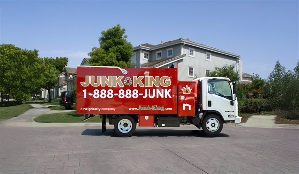 A junk king truck parked in a parking lot.