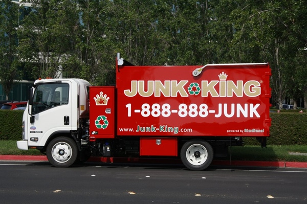 A Junk King truck parked on a street.